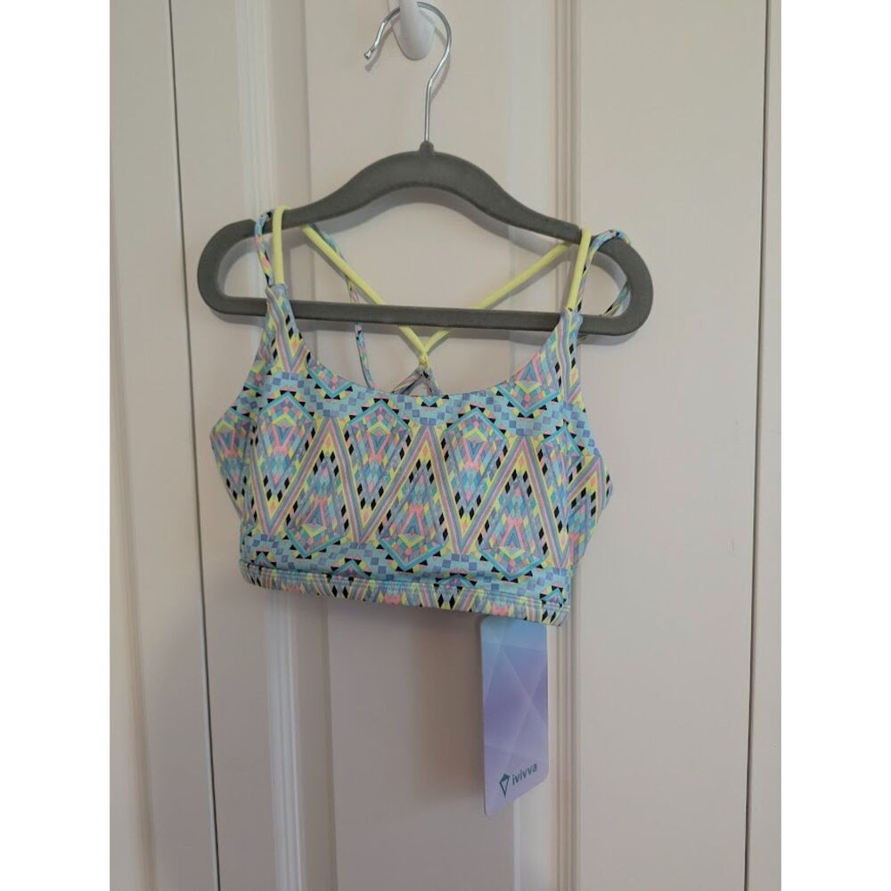 NWT ivivva by Lululemon "Own the Move" Sports Bra Girls 10 geometric blue pink